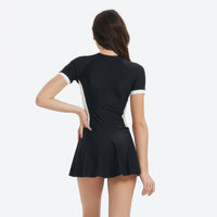 
                  
                    Serene UPF50+ women's one-piece rashguard - long sleeve black rashguard with skirt views, UPF50+ sun protection
                  
                