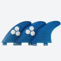 
                  
                    FCS fiberglass thruster fin set 3-pack - gray and blue thruster fin sets, on-model hood side view, for thruster setup boards
                  
                